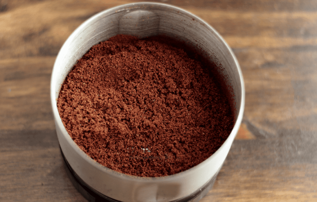 ground cacao nibs in a spice grinder