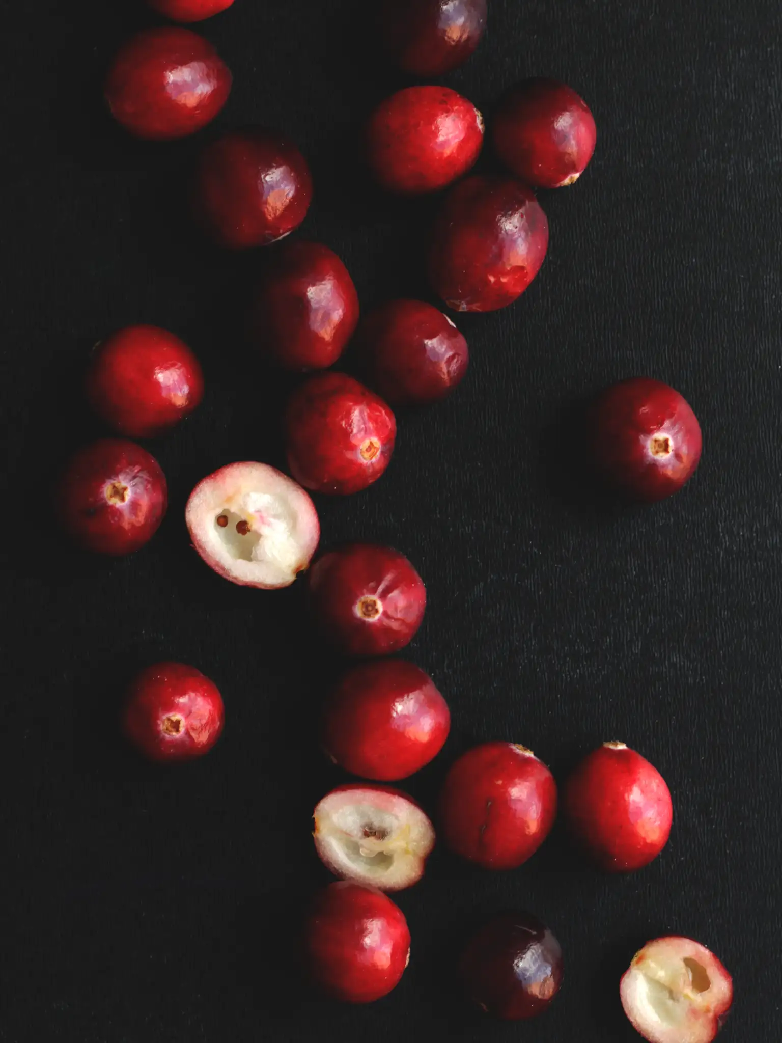 fresh cranberries on a black background