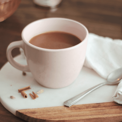 Pink mug with cacao herbal tea