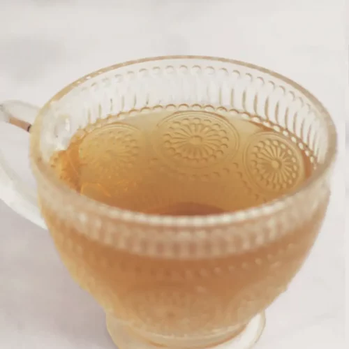 Glass cup of herbal tea