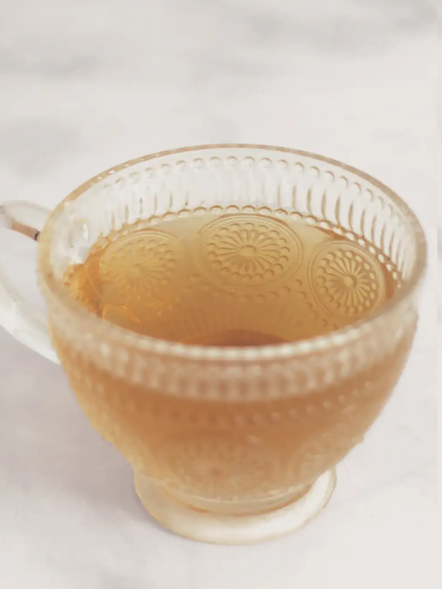 Glass cup of herbal tea