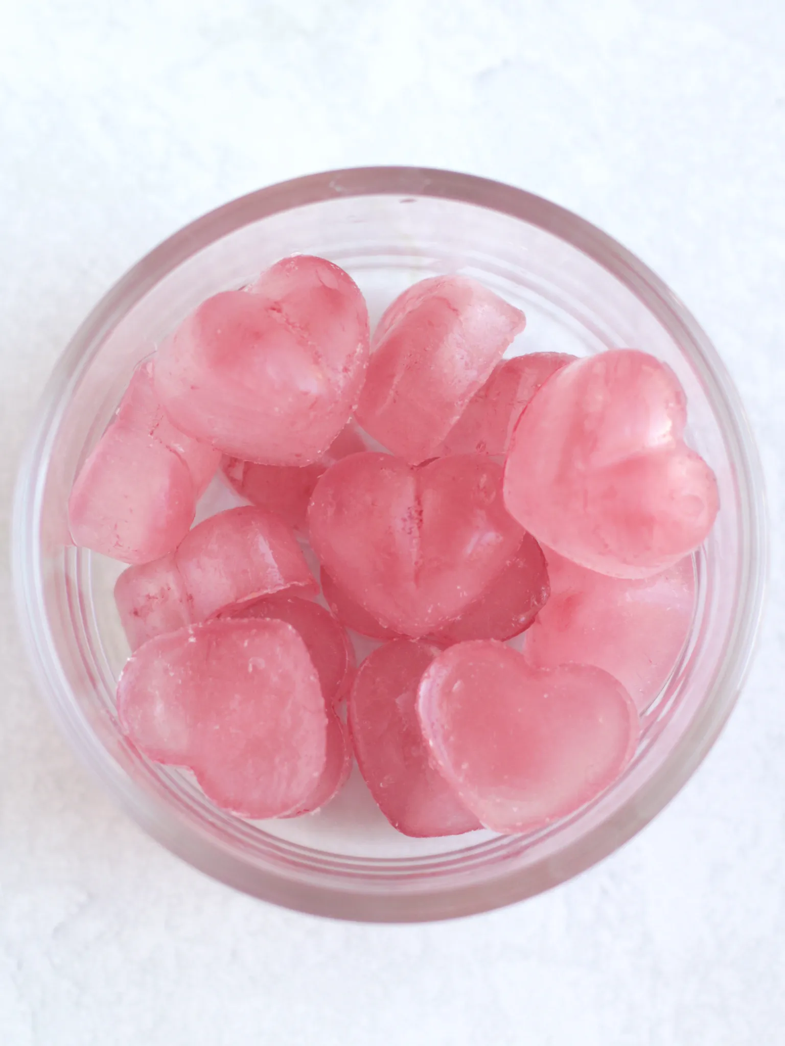 Frozen rose tea hearts in a glass dish